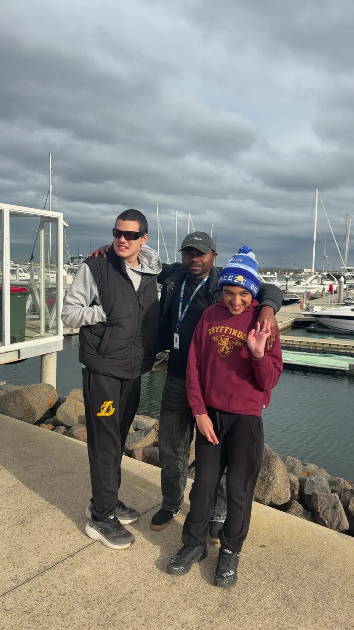Participants at a waterfront marina during a community outing