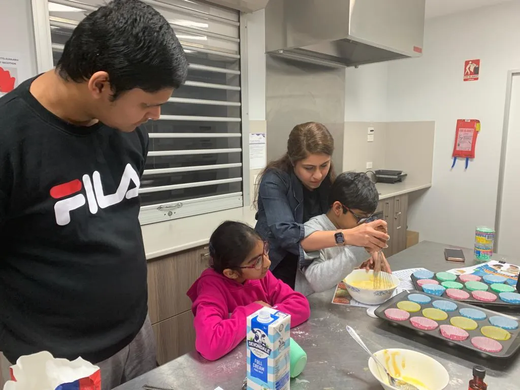 A participant measuring and mixing ingredients during a Nhanya Foundation cooking and life skills session