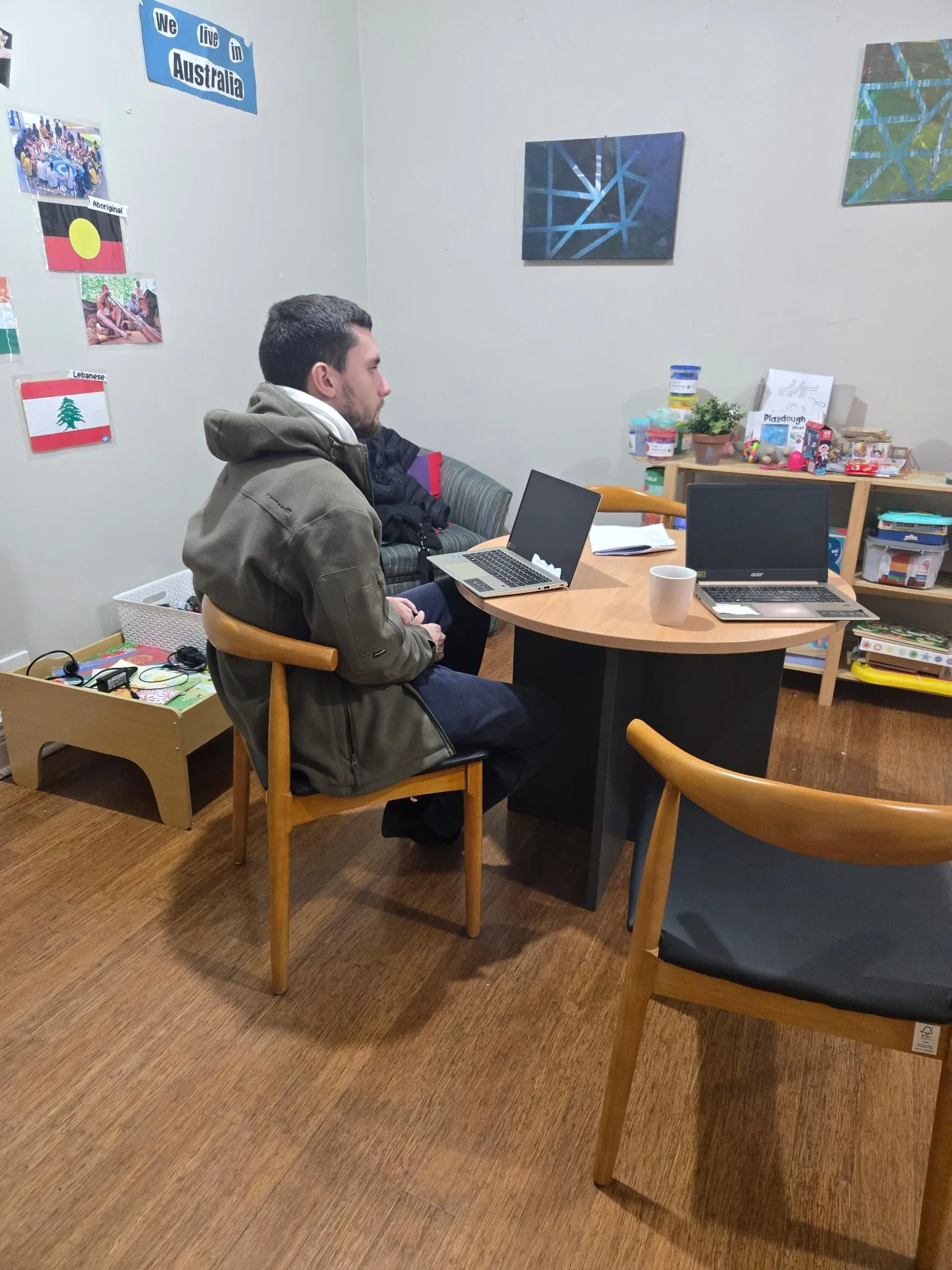 Employment Program participants in a group discussion with support staff