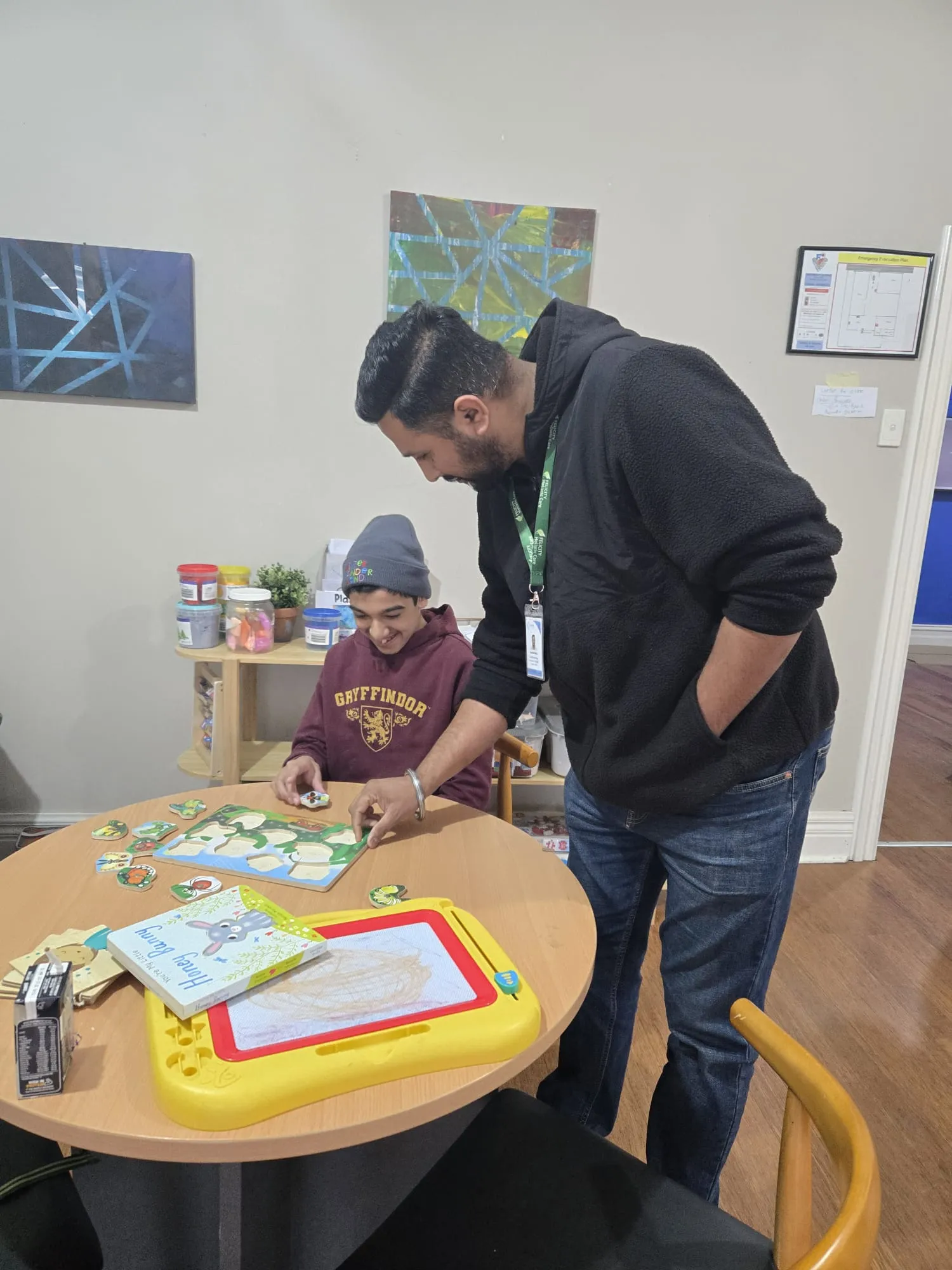 A participant exploring kinetic sand as a sensory play activity