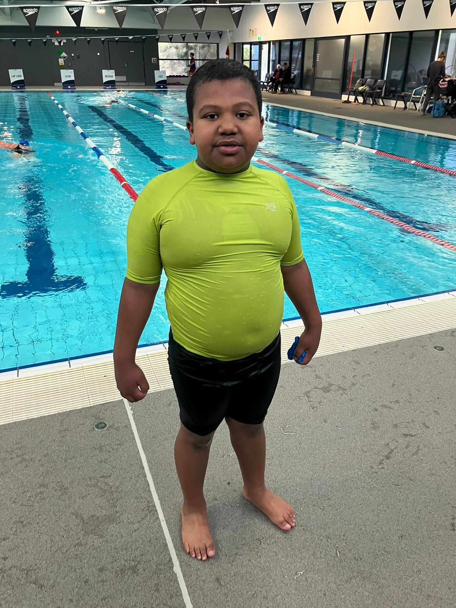 A participant at an indoor swimming pool during a recreation session